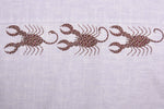 Load image into Gallery viewer, Close-up of three hand-painted Bhil scorpion artworks across back shoulder panel on linen shirt showing detailed dot work.