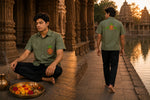 Load image into Gallery viewer, Odisha Pattachitra hand-painted linen shirt featuring a ceremonial kalash artwork on the chest pocket and twin parrot motifs arranged around a central kalash across the back, observed in front and back within a historic temple corridor and lakeside temple setting during golden hour.