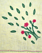 Close-up of a flowering tree artwork on a Bihar Sujani hand-embroidered linen handkerchief, showing embroidered blossoms, leaves, and border stitching.