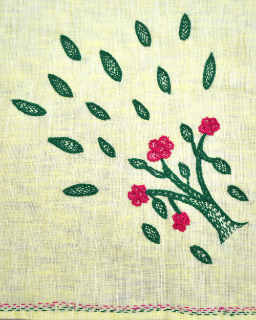 Close-up of a flowering tree artwork on a Bihar Sujani hand-embroidered linen handkerchief, showing embroidered blossoms, leaves, and border stitching.