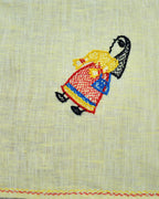 Close-up of artwork depicting a woman carrying a shopping bag on a Bihar Sujani hand-embroidered linen handkerchief.