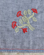 Close-up of the flowering branch artwork on a Bihar Sujani hand-embroidered khadi handkerchief.