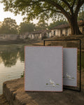 Chamba Rumal from the Jungle collection crafted in handwoven khadi cotton, featuring a hand embroidered duck and duckling walking together in the lower-left corner, hand hemmed and presented before a mirror that reveals identical embroidery on both sides through the traditional do-rukha technique.