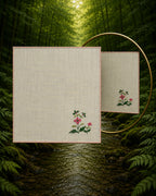 Chamba Rumal from the Pushp Vatika collection in 100% linen featuring a hand embroidered Four Leaf Pink Flower, finished with a red hand-hemmed edge and photographed with a mirror to demonstrate the traditional double-sided do-rukha embroidery technique.
