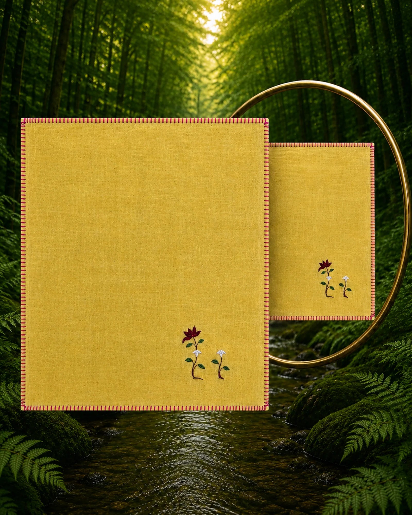 A hand embroidered maroon flower with a little bud decorates this 100% Khadi cotton Chamba Rumal from the Pushp Vatika collection, hand hemmed and presented with a mirror revealing the traditional double-sided do-rukha embroidery.