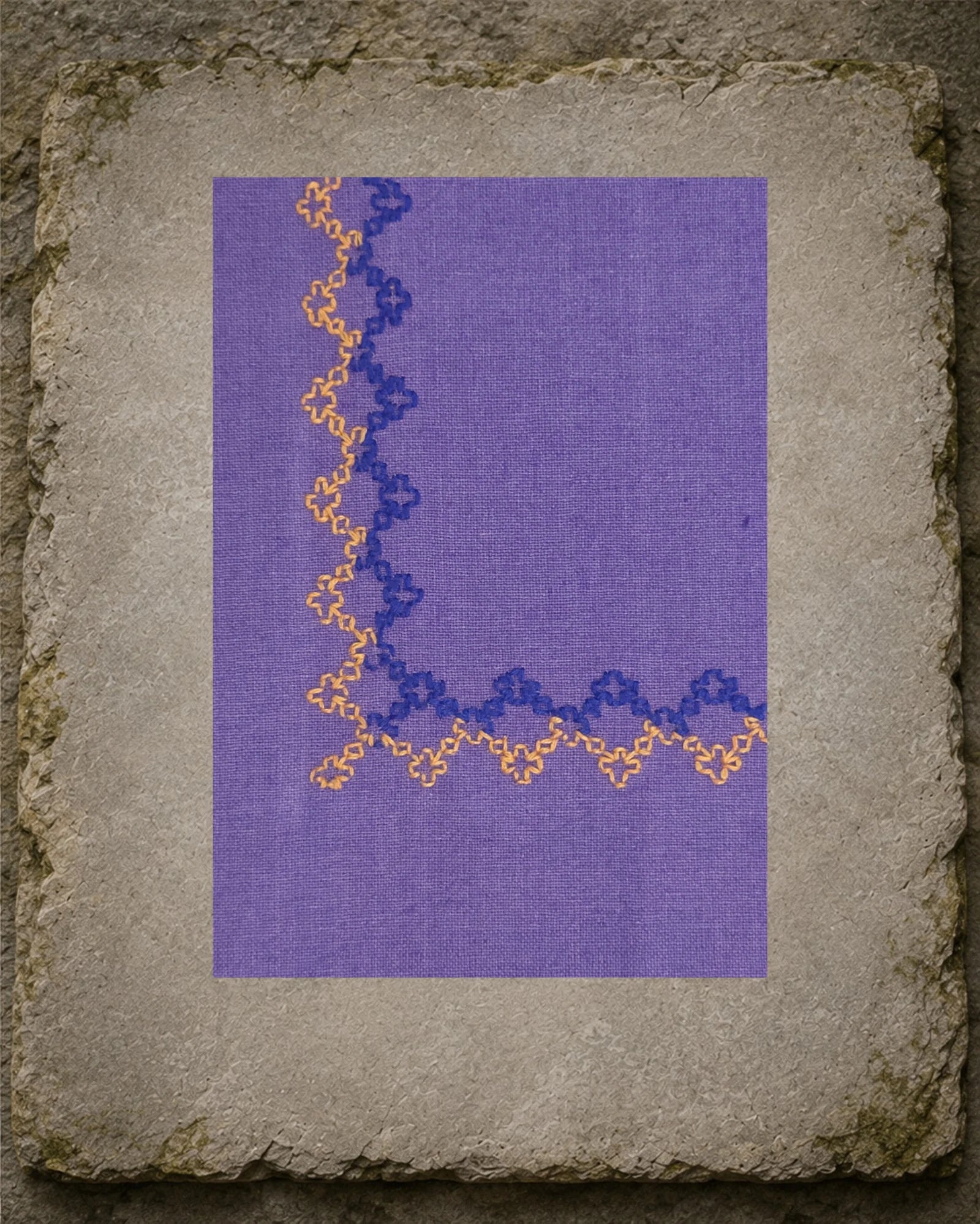 Detailed view of the Kasuti Betel Box border at one corner, revealing the repeating counted stitches and visible weave of the khadi cotton.