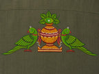 Close-up of hand-painted Odisha Pattachitra back motif on linen shirt, showing twin parrot forms, ceremonial kalash detailing, pigment variation, and textile weave.