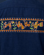 Close-up of the Sohrai Jeev Dhara upper back artwork featuring a peacock and peahen, fawn, flowering vegetation and hand-painted borders.