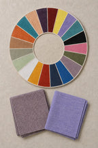 Svasutra set of two handloom muslin khadi handkerchiefs in heather grid and dusk periwinkle beside the House colour palette.