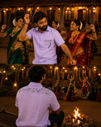 Warli Aabha hand-painted linen shirt shown in a styled context composition featuring front and back views. The pocket artwork depicts Warli figures, birds, flowering plants and basket-carrying forms, while the upper back artwork presents a continuous narrative panel with warli dancers, animals, ritual elements and community scenes. Set within an illuminated heritage courtyard during an evening cultural performance, with traditional dancers, gathering spectators and a bonfire creating a festive atmosphere.