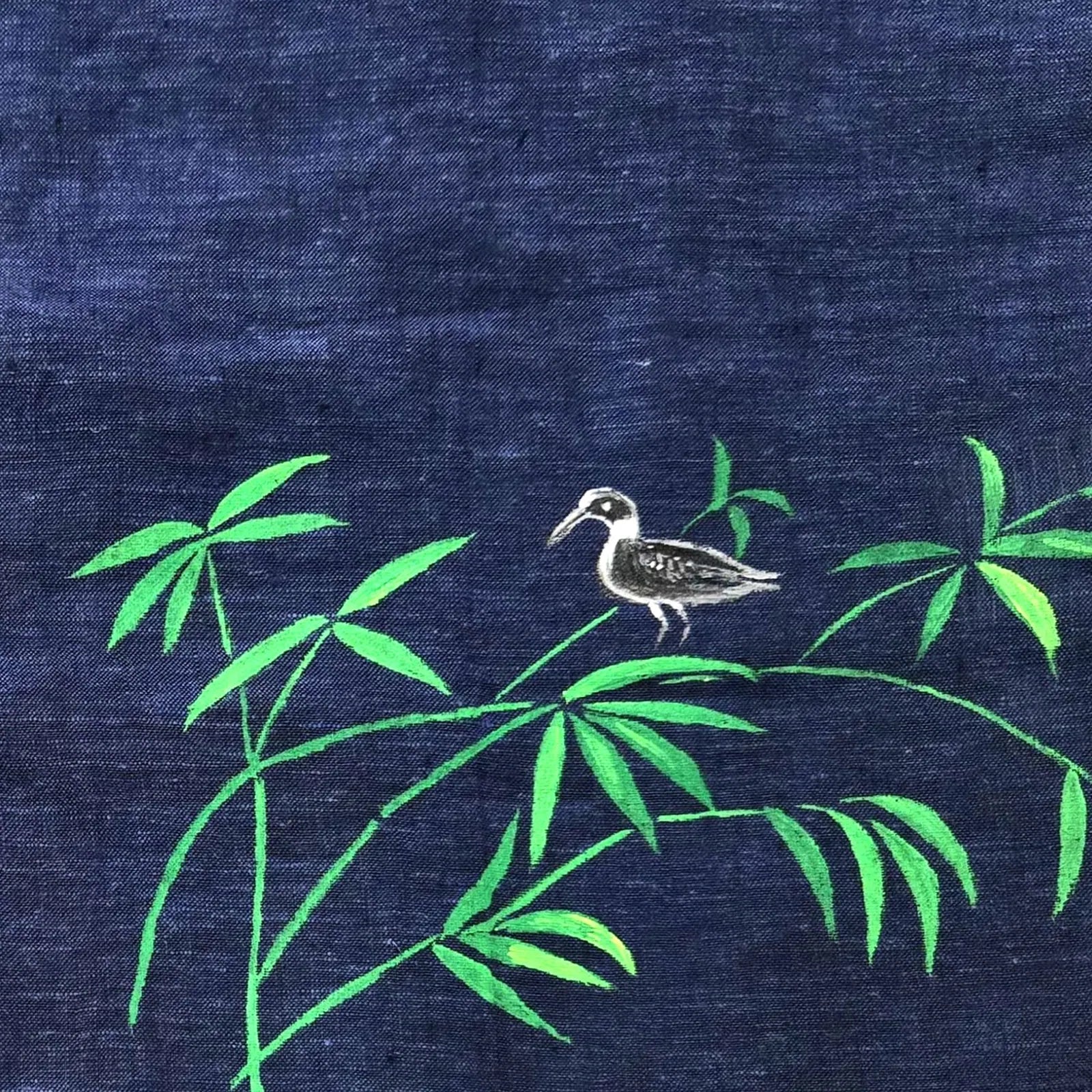 Bottom left artwork detail from the Vanantara hand-painted linen shirt featuring a bird positioned across branching bamboo forms, showcasing the brushwork, composition and fine detailing of the original artwork.