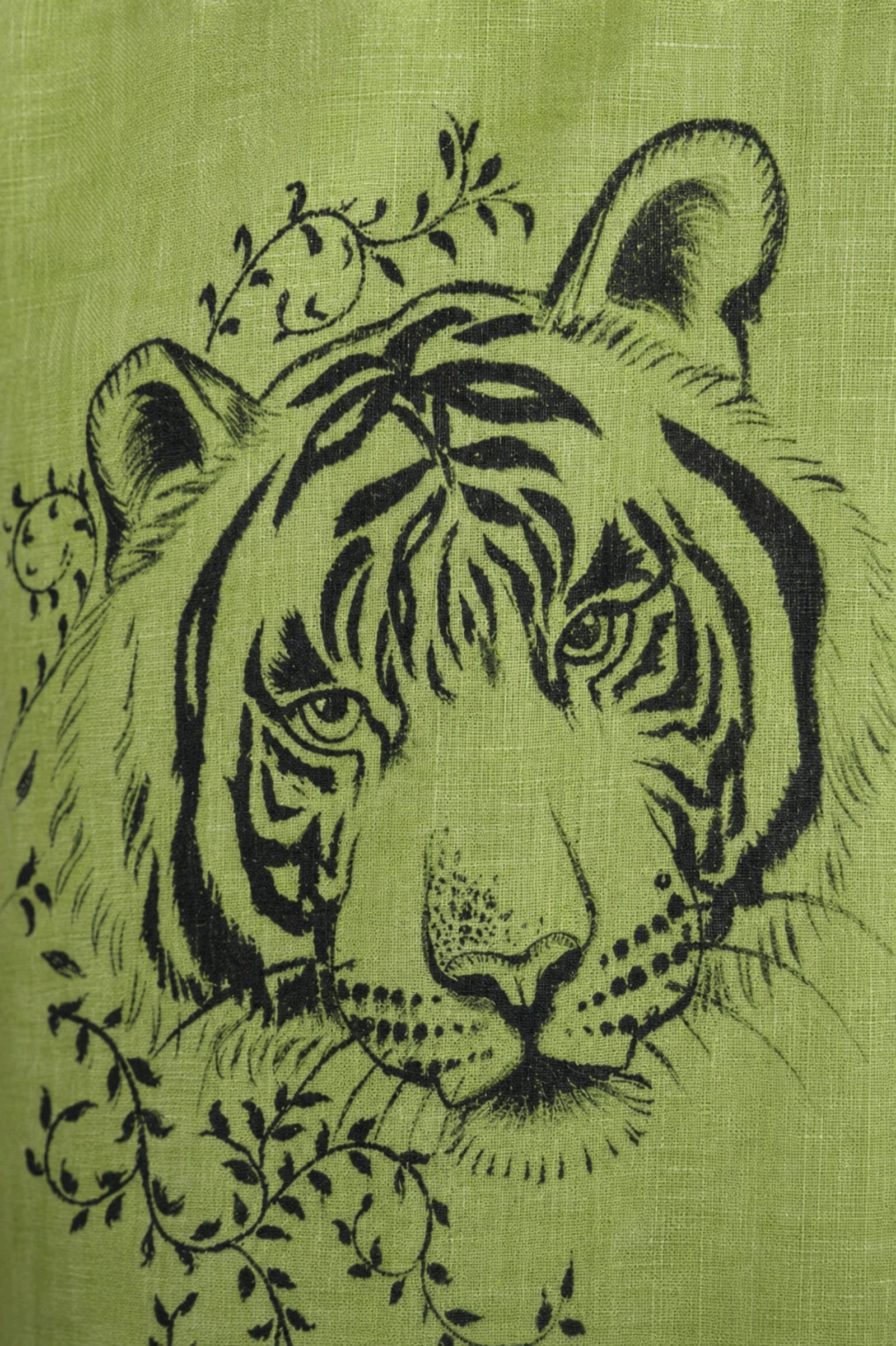 Lower front panel detail of the Vanchar hand-painted linen shirt featuring tiger artwork with surrounding botanical detailing.